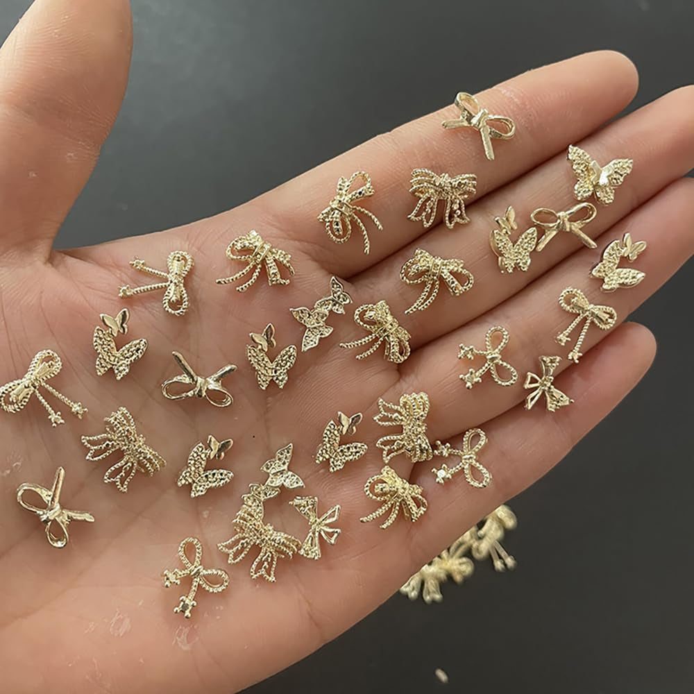 50 Stück 3D Gold Bow Nail Charms Butterfly Nail Art Charms Legierung Bogen Nagel Charms Nägel Zubehör Schleife Nagelschmuck Metall Schleifen Schmetterling Nageldesign Nagelanhänger Nailart Strasssteine