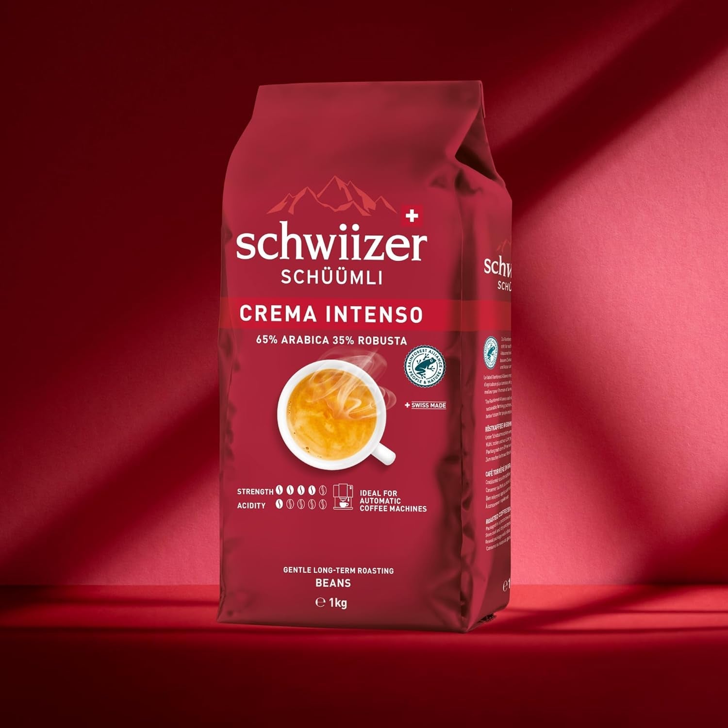 Schwiizer Schüümli Intenso, Arabica/Robusta-Kaffeebohnen, vollmundig und intensiv, ideal für automatische Espressomaschinen, Stärke 4/5, mittlere Röstung, Rainforest Alliance, 1kg