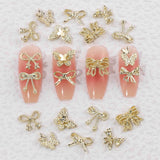 50 Stück 3D Gold Bow Nail Charms Butterfly Nail Art Charms Legierung Bogen Nagel Charms Nägel Zubehör Schleife Nagelschmuck Metall Schleifen Schmetterling Nageldesign Nagelanhänger Nailart Strasssteine
